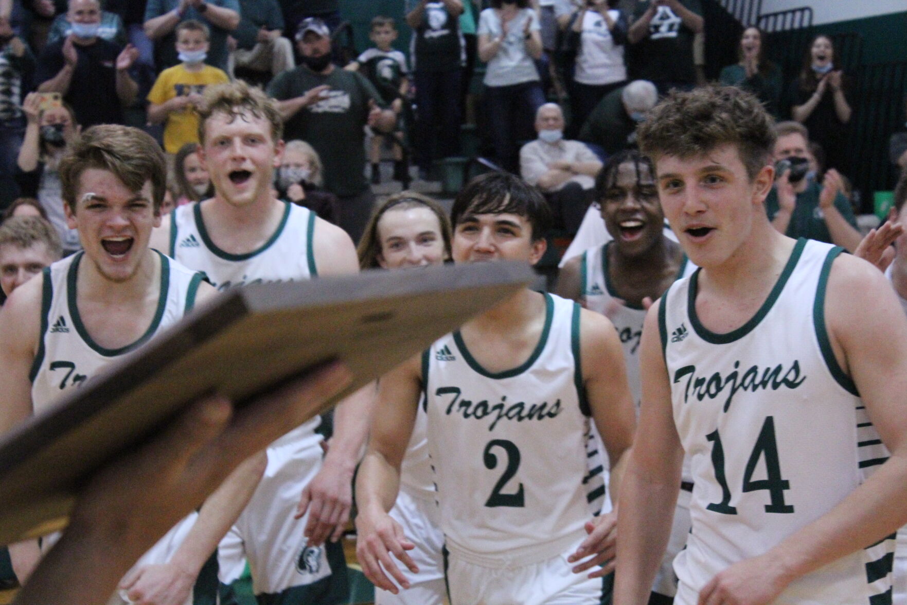 Hampshire basketball retrieves the championship plaque.